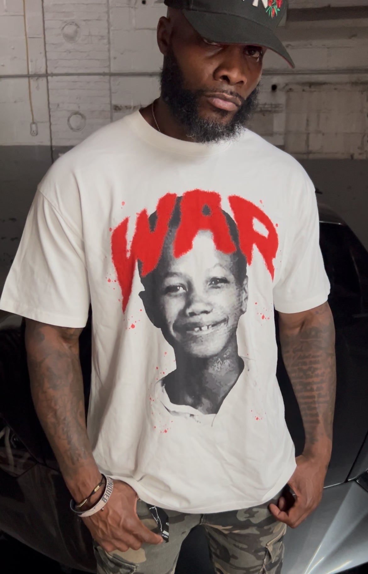 WAR T-Shirt, We Are Resilient, Malcolm X, Young Malcolm X, Positive Affirmation, Motivational Clothing, Inspirational Shirt, Streetwear, Graphic Tee, Oversized T-Shirt, Boxy Fit, Hip Hop Fashion, Urban Wear, Empowerment, Resilience, Strength, Black History, Positive Energy, Manifestation, High Vibe Clothing, Law of Attraction